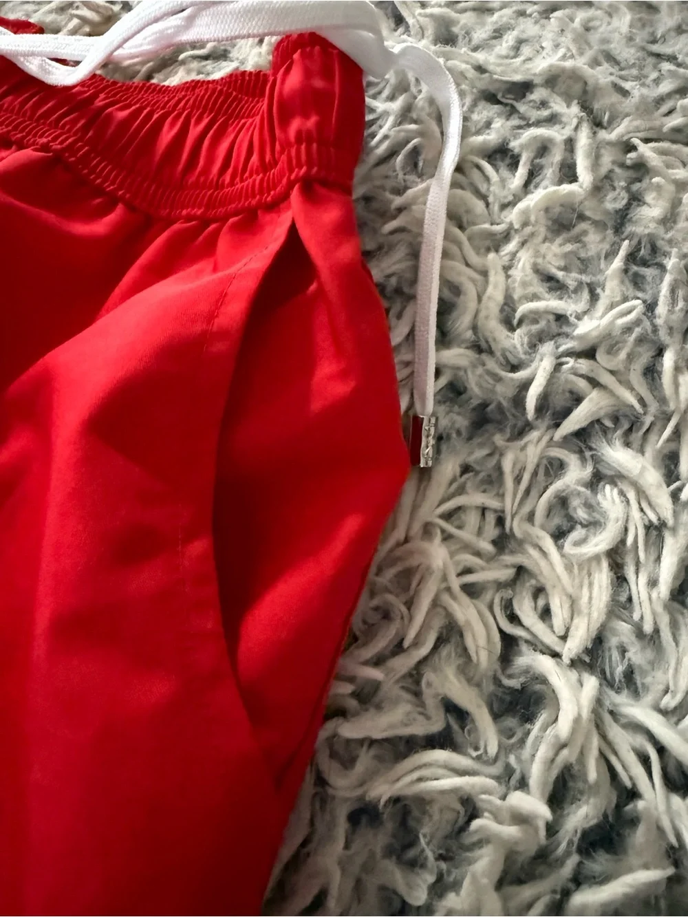 2xist men’s red lined 5” swimsuit. It is a size large.